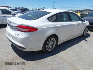 2017 Ford Fusion Hybrid SE with VIN 3FA6P0LU3HR326980, listed as a IAAI auction lot 42692591 with 141,122 mi miles and . Bid and sale history available at DreamBid. Image 4.