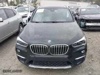 2018 BMW X1 xDrive28i with VIN WBXHT3C34J5K21576, listed as a IAAI auction lot 41822390 with 69,645 mi miles. Bid and sale history available at carsss.com. Image 12.