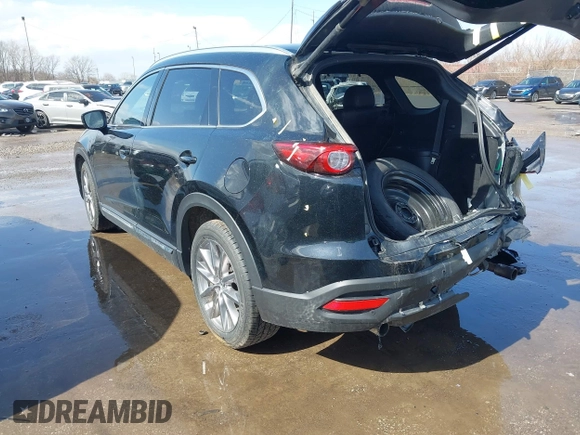 2020 Mazda CX-9 Grand Touring with VIN JM3TCBDY2L0413839, listed as a IAAI auction lot 41720713 with 48,964 mi miles and . Bid and sale history available at DreamBid. Image 3.