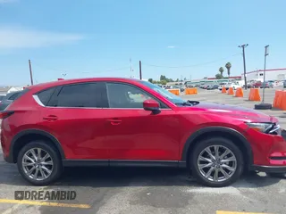 2021 Mazda CX-5 Grand Touring with VIN JM3KFADM6M1373111, listed as a IAAI auction lot 42784431 with 14,374 mi miles and . Bid and sale history available at DreamBid. Image 13.