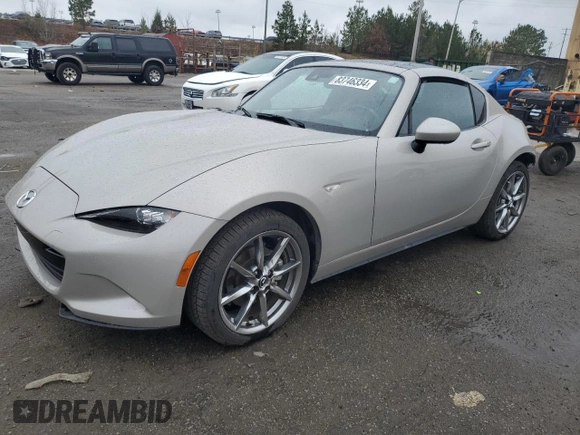 2022 Mazda MX-5 Miata Grand Touring z VIN JM1NDAM78N0504942, wystawiony jako Copart lot #83746334 z przebiegiem 17 610 mil mil oraz Szkoda całkowita • Salvage title. Historia ofert i sprzedaży dostępna na DreamBid. Obrazek 1.