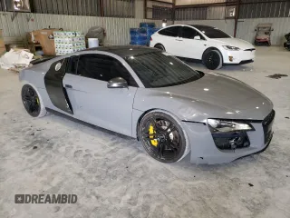 2009 Audi R8 4.2L z VIN WUAAU34279N002238, wystawiony jako Copart lot #74154804 z przebiegiem 71 425 mil mil oraz Szkoda całkowita • Salvage title. Historia ofert i sprzedaży dostępna na DreamBid. Obrazek 4.