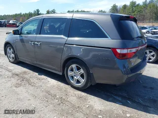 2012 Honda Odyssey Touring with VIN 5FNRL5H90CB048070, listed as a IAAI auction lot 41835799 with 162,288 mi miles. Bid and sale history available at carsss.com. Image 3.