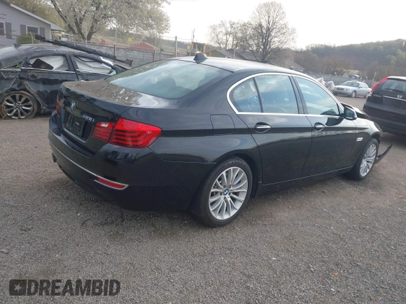 2014 BMW 5 Series 528i xDrive with VIN WBA5A7C52ED616976, listed as a IAAI auction lot 42067334 with 98,286 mi miles and . Bid and sale history available at DreamBid. Image 4.