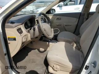 2009 Kia Rio LX with VIN KNADE223X96439445, listed as a Copart auction lot 54619335 with 102,120 mi miles and Salvage Title. Bid and sale history available at DreamBid. Image 7.