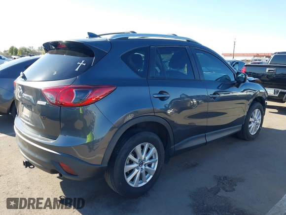 2016 Mazda CX-5 Touring with VIN JM3KE2CY4G0695947, listed as a IAAI auction lot 41824490 with 162,191 mi miles and . Bid and sale history available at carsss.com. Image 4.