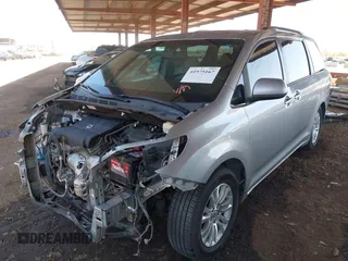 2016 Toyota Sienna XLE with VIN 5TDYK3DCXGS751231, listed as a IAAI auction lot 41975167 with 135,266 mi miles. Bid and sale history available at carsss.com. Image 2.