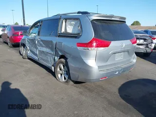 2014 Toyota Sienna LE AAS with VIN 5TDKK3DC7ES435109, listed as a IAAI auction lot 41963135 with 175,517 mi miles and . Bid and sale history available at DreamBid. Image 3.