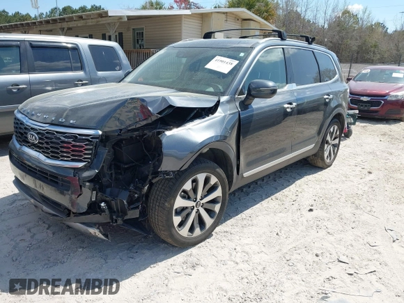 2020 Kia Telluride S with VIN 5XYP64HC4LG048473, listed as a IAAI auction lot 41901438 with 125,089 mi miles and . Bid and sale history available at DreamBid. Image 2.