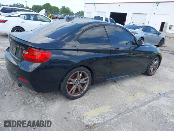 2014 BMW 2 Series M235i with VIN WBA1J7C50EVW84072, listed as a IAAI auction lot 41917841 with 102,745 mi miles and . Bid and sale history available at carsss.com. Image 4.