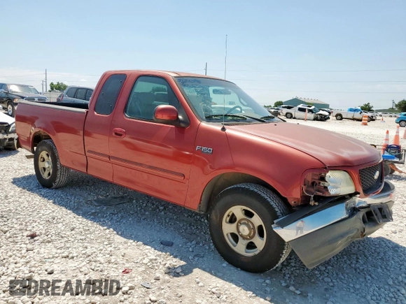 2002 Ford F-150 XL with VIN 1FTRX17202NA40522, listed as a Copart auction lot 58208915 with 100,297 mi miles and Salvage title. Bid and sale history available at DreamBid. Image 4.