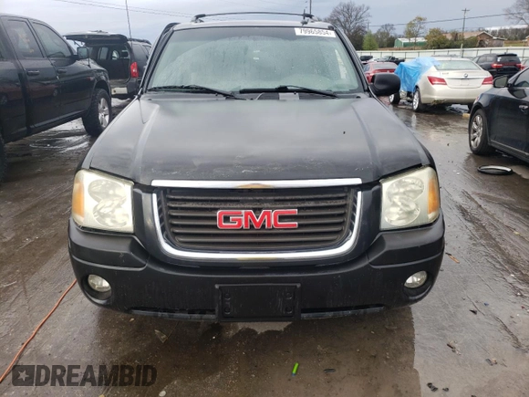 2004 GMC Envoy SLT with VIN 1GKDT13S042310076, listed as a Copart auction lot 79965854 with 220,506 mi miles and Salvage Title. Bid and sale history available at carsss.com. Image 5.