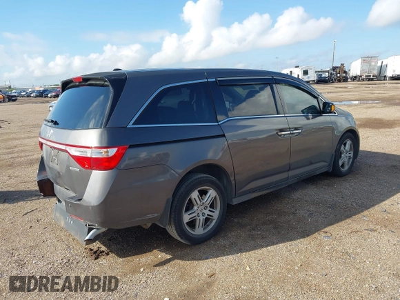 2011 Honda Odyssey Touring with VIN 5FNRL5H93BB104436, listed as a IAAI auction lot 40426003 with 93,342 mi miles and . Bid and sale history available at DreamBid. Image 4.