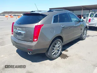 2015 Cadillac SRX Performance Collection with VIN 3GYFNFE35FS569682, listed as a IAAI auction lot 42322229 with 124,365 mi miles and . Bid and sale history available at DreamBid. Image 4.