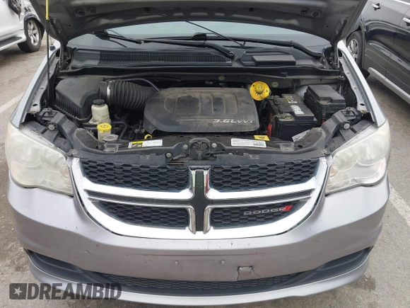 2014 Dodge Grand Caravan SXT with VIN 2C4RDGCG0ER417662, listed as a IAAI auction lot 41933279 with 156,751 mi miles and . Bid and sale history available at DreamBid. Image 10.