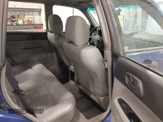 2003 Subaru Forester X with VIN JF1SG63663H708501, listed as a IAAI auction lot 41547662 with 208,134 mi miles. Bid and sale history available at carsss.com. Image 8.