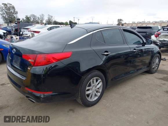 2012 Kia Optima LX with VIN KNAGM4A72C5291451, listed as a IAAI auction lot 42068559 with 121,548 mi miles and . Bid and sale history available at carsss.com. Image 4.