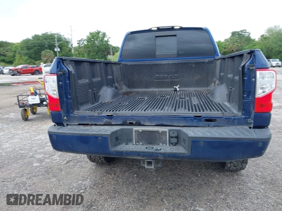 2019 Nissan Titan XD SV with VIN 1N6BA1F46KN514637, listed as a IAAI auction lot 41986617 with 123,872 mi miles. Bid and sale history available at carsss.com. Image 16.