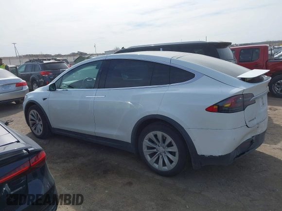 2018 Tesla Model X 75D with VIN 5YJXCBE27JF121834, listed as a IAAI auction lot 41769246 with 90,814 mi miles and . Bid and sale history available at carsss.com. Image 14.