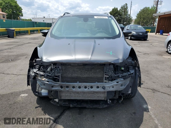 2015 Ford Escape Titanium with VIN 1FMCU9J98FUB49112, listed as a Copart auction lot 58989915 with 94,060 mi miles and Salvage title. Bid and sale history available at DreamBid. Image 5.