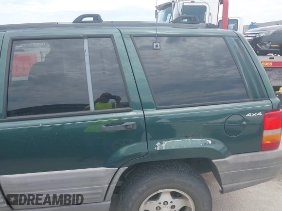1998 Jeep Grand Cherokee Laredo with VIN 1J4GZ58S7WC284106, listed as a IAAI auction lot 42558498 with 316,354 mi miles and . Bid and sale history available at DreamBid. Image 6.