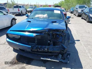 2010 Dodge Challenger R/T z VIN 2B3CJ5DT1AH129732, wystawiony jako IAAI lot #42205632 z przebiegiem 118 550 mil mil oraz . Historia ofert i sprzedaży dostępna na DreamBid. Obrazek 12.