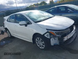 2023 Toyota Corolla Hybrid LE with VIN JTDBCMFEXP3017214, listed as a IAAI auction lot 40590468 with 9,428 mi miles. Bid and sale history available at carsss.com. Image 1.