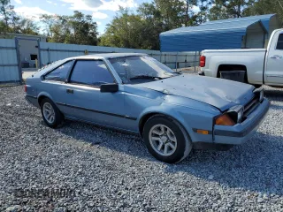 1983 Toyota Celica z VIN JT2RA64L7D6174381, wystawiony jako Copart lot #75986554 z przebiegiem 312 583 mil mil oraz Szkoda całkowita • Salvage title. Historia ofert i sprzedaży dostępna na DreamBid. Obrazek 4.