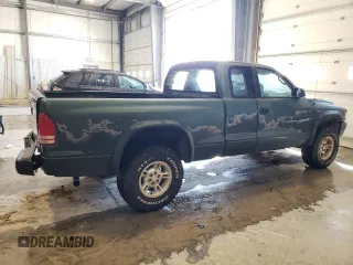 1999 Dodge Dakota SLT with VIN 1B7GG22Y9XS149398, listed as a Copart auction lot 47950025 with 173,413 mi miles and Salvage Title. Bid and sale history available at carsss.com. Image 3.