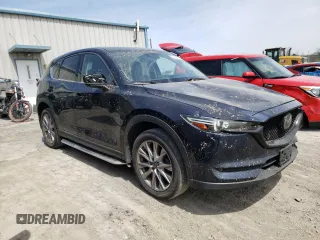 2020 Mazda CX-5 Grand Touring with VIN JM3KFBDM0L0767634, listed as a Copart auction lot 54433935 with 57,901 mi miles and Salvage Title. Bid and sale history available at carsss.com. Image 4.