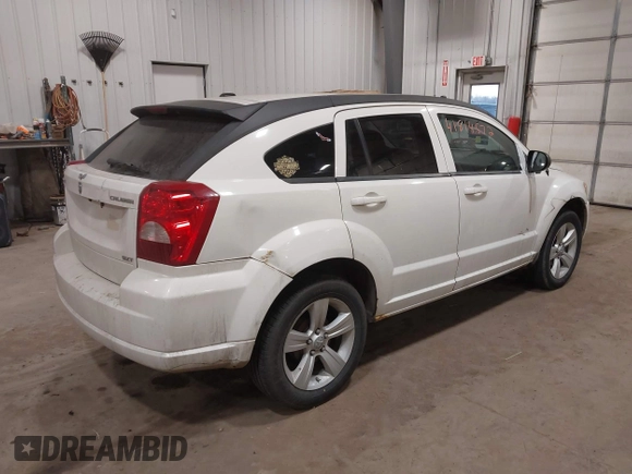 2010 Dodge Caliber SXT with VIN 1B3CB4HA3AD590654, listed as a IAAI auction lot 41814572 with 203,422 mi miles and . Bid and sale history available at DreamBid. Image 4.