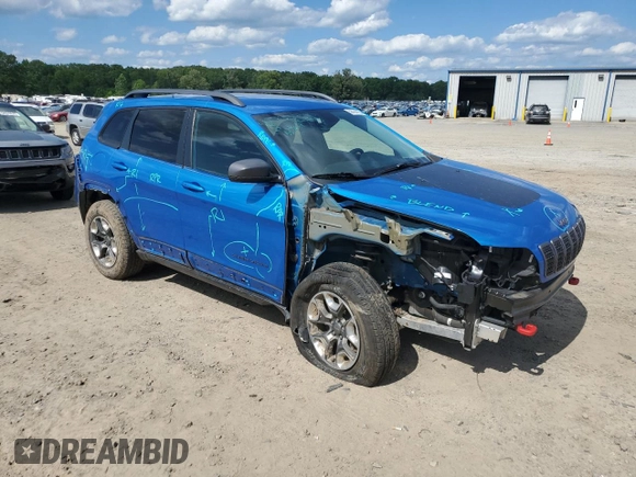 2019 Jeep Cherokee Trailhawk with VIN 1C4PJMBX0KD311114, listed as a Copart auction lot 58799765 with 60,833 mi miles and Salvage title. Bid and sale history available at DreamBid. Image 4.