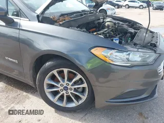2017 Ford Fusion Hybrid SE with VIN 3FA6P0LU5HR336779, listed as a IAAI auction lot 42691789 with 140,720 mi miles and . Bid and sale history available at DreamBid. Image 6.