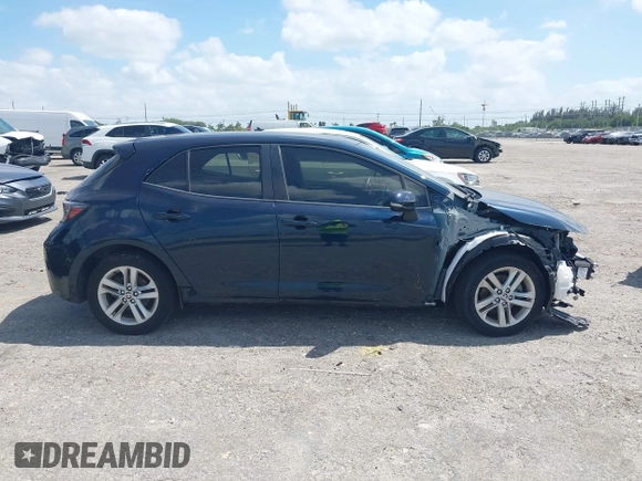 2019 Toyota Corolla Hatchback SE with VIN JTNK4RBE3K3061589, listed as a IAAI auction lot 42123273 with 90,491 mi miles. Bid and sale history available at carsss.com. Image 13.