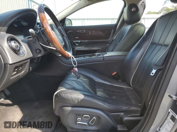 2015 Jaguar XJ Portfolio with VIN SAJWJ2GD2F8V75238, listed as a Copart auction lot 73633984 with 102,545 mi miles and Salvage title. Bid and sale history available at DreamBid. Image 7.