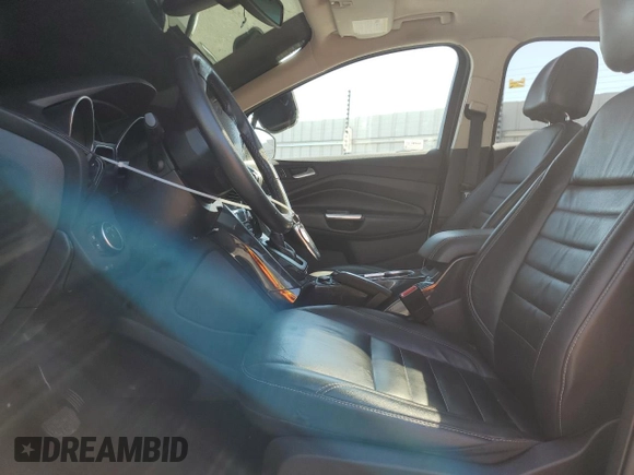 2016 Ford Escape Titanium with VIN 1FMCU0J99GUB83458, listed as a Copart auction lot 48828195 with 74,250 mi miles and Salvage Title. Bid and sale history available at carsss.com. Image 7.