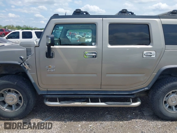 2003 Hummer H2 with VIN 5GRGN23U23H148326, listed as a IAAI auction lot 42068326 with 149,396 mi miles. Bid and sale history available at carsss.com. Image 14.