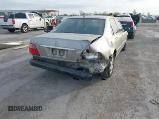 2002 Acura RL z VIN JH4KA96552C008589, wystawiony jako IAAI lot #41860930 z przebiegiem 210 847 mil mil oraz . Historia ofert i sprzedaży dostępna na DreamBid. Obrazek 6.