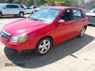 2009 Kia Spectra with VIN KNAFE241995024997, listed as a IAAI auction lot 42095812 with 217,555 mi miles. Bid and sale history available at carsss.com. Image 2.