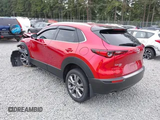 2023 Mazda CX-30 S Premium with VIN 3MVDMBDM1PM520048, listed as a IAAI auction lot 42468172 with 7,277 mi miles and . Bid and sale history available at DreamBid. Image 3.