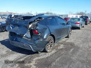 2022 Tesla Model X with VIN 7SAXCDE52NF345835, listed as a IAAI auction lot 41823522 with 24,401 mi miles and . Bid and sale history available at DreamBid. Image 4.