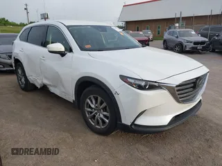 2018 Mazda CX-9 Touring z VIN JM3TCACY4J0236848, wystawiony jako IAAI lot #42258927 z przebiegiem 84 740 mil mil oraz . Historia ofert i sprzedaży dostępna na DreamBid. Obrazek 1.