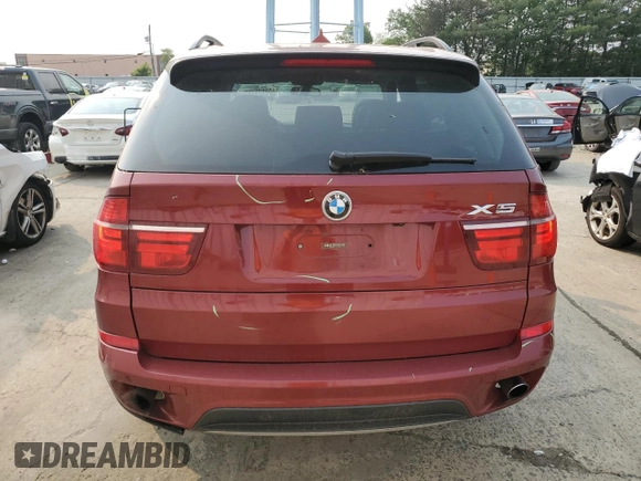 2012 BMW X5 35i z VIN 5UXZV4C56CL749152, wystawiony jako Copart lot #59525155 z przebiegiem 110 773 mil mil oraz Szkoda całkowita • Salvage title. Historia ofert i sprzedaży dostępna na DreamBid. Obrazek 6.