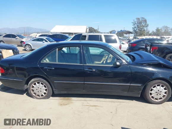 2001 Mercedes-Benz E-Class with VIN WDBJF65J11B368277, listed as a IAAI auction lot 41855716 with 207,864 mi miles. Bid and sale history available at carsss.com. Image 13.