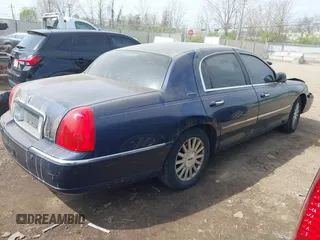 2003 Lincoln Town Car Executive z VIN 1LNHM81W43Y632820, wystawiony jako IAAI lot #42048881 z przebiegiem 137 738 mil mil oraz . Historia ofert i sprzedaży dostępna na DreamBid. Obrazek 4.