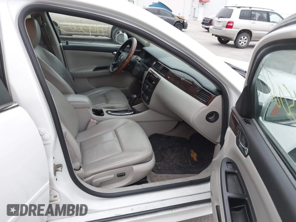 2013 Chevrolet Impala LTZ with VIN 2G1WC5E37D1223897, listed as a IAAI auction lot 41950823 with 165,237 mi miles and . Bid and sale history available at DreamBid. Image 5.
