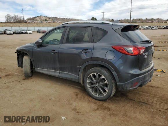 2016 Mazda CX-5 Grand Touring z VIN JM3KE4DY0G0633861, wystawiony jako Copart lot #47748645 z przebiegiem 112 219 mil mil oraz Szkoda całkowita • Salvage title. Historia ofert i sprzedaży dostępna na DreamBid. Obrazek 2.