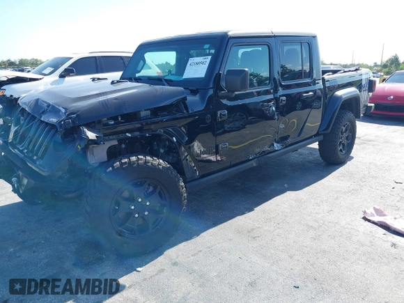 2021 Jeep Gladiator Willys with VIN 1C6HJTAGXML613431, listed as a IAAI auction lot 42180502 with 64,572 mi miles and . Bid and sale history available at DreamBid. Image 18.