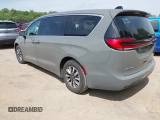 2023 Chrysler Pacifica Hybrid Touring L with VIN 2C4RC1L73PR522988, listed as a IAAI auction lot 42280263 with 54,939 mi miles and . Bid and sale history available at DreamBid. Image 3.