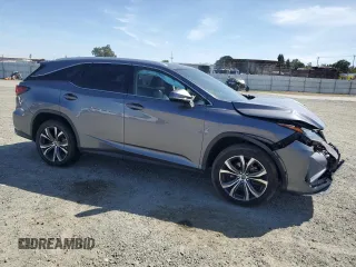 2020 Lexus RX 350L with VIN JTJHZKFA4L2027079, listed as a Copart auction lot 57151485 with 60,890 mi miles and Salvage title. Bid and sale history available at DreamBid. Image 4.